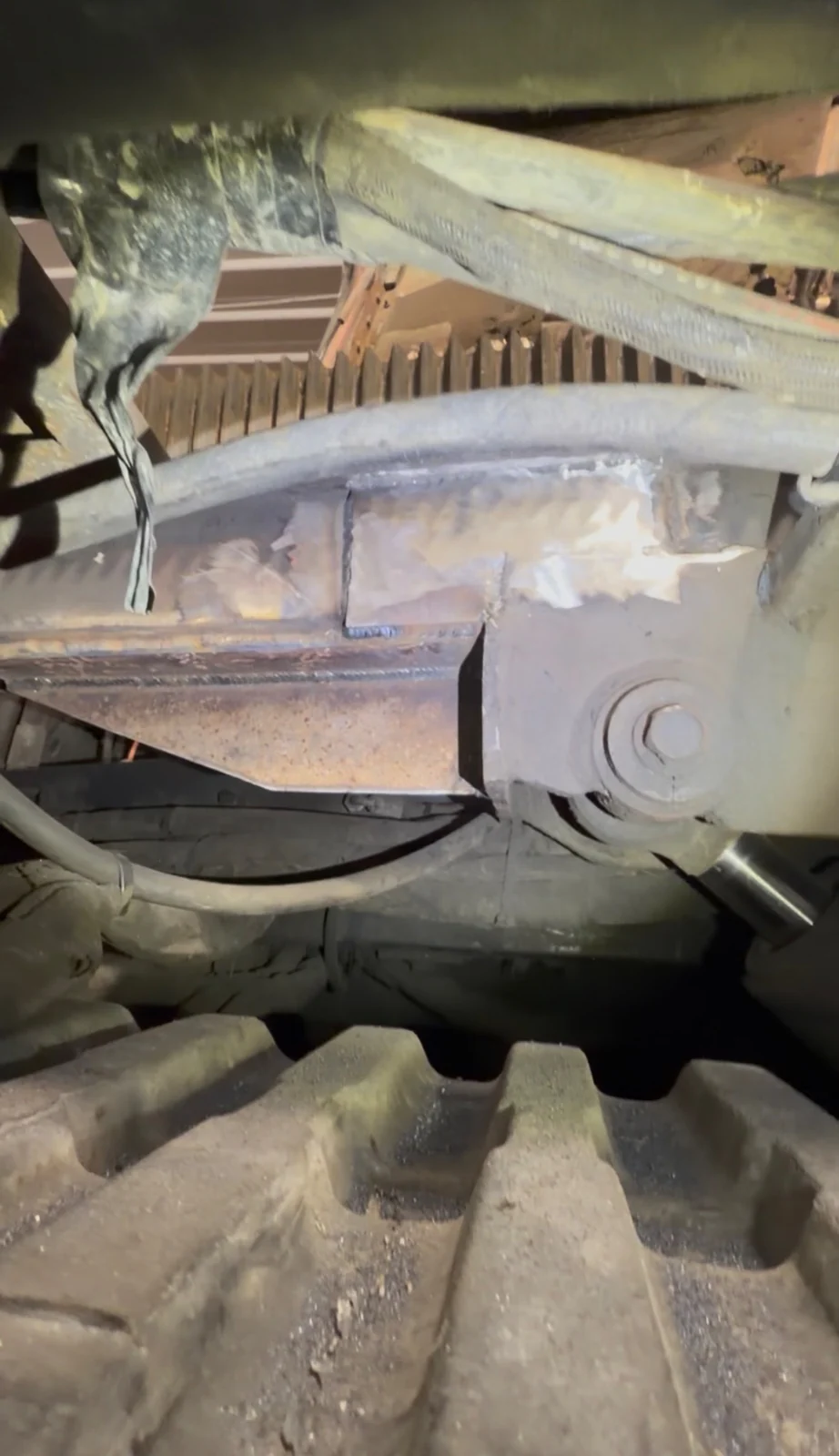 Welded metal repair underneath a vehicle